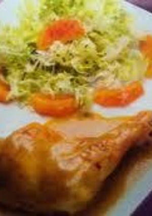 Una foto de Muslitos a la naranja con pimiento