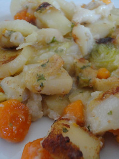 Una foto de Sepia con patatas al horno