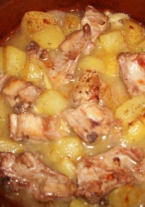 Una foto de Conejo rústido al horno con limón