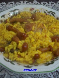 Una foto de Arroz caldoso con conejo y setas Nameko