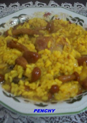 Una foto de Arroz caldoso con conejo y setas Nameko