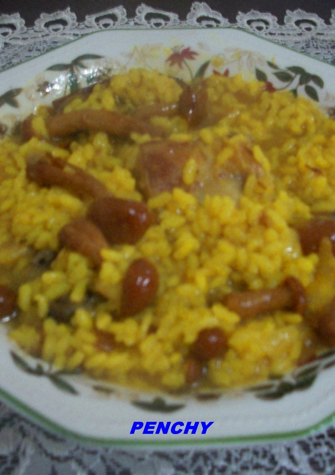 Una foto de Arroz caldoso con conejo y setas Nameko