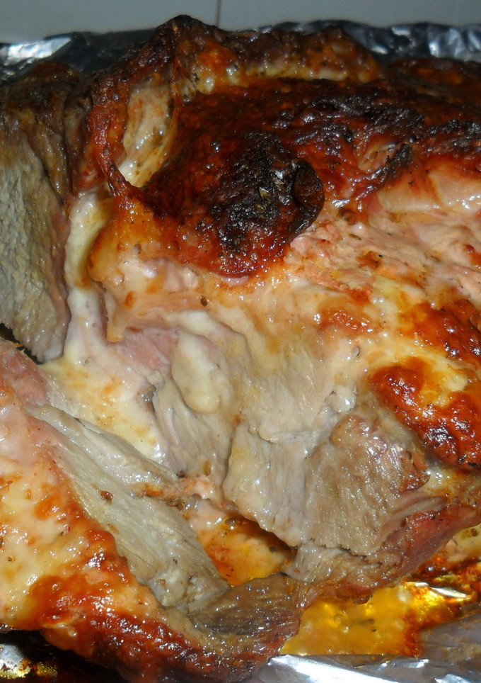 Una foto de Aguja de cerdo rellena con queso y bacon