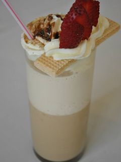 Una foto de Copa de café lactea chocolatosa