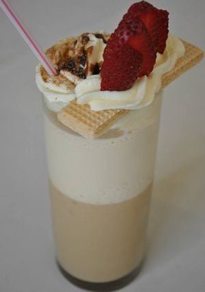 Una foto de Copa de café lactea chocolatosa