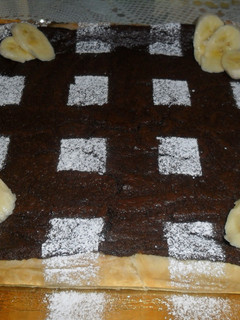 Una foto de Tarta con crema de chocolate y queso