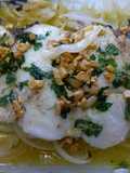 Cogote de merluza con cebolla
