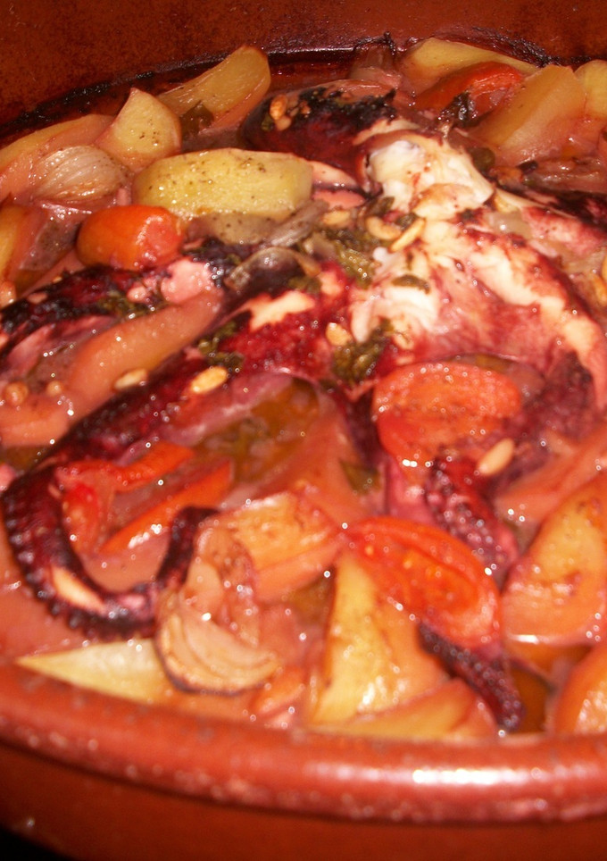 Una foto de Pulpo asado al horno con vino