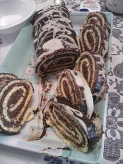 Una foto de Pionono de chocolate y dulce de leche