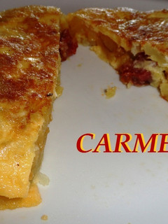 Una foto de Tortilla de patatas y embutido de lomo ibérico