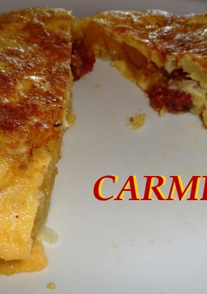 Una foto de Tortilla de patatas y embutido de lomo ibérico