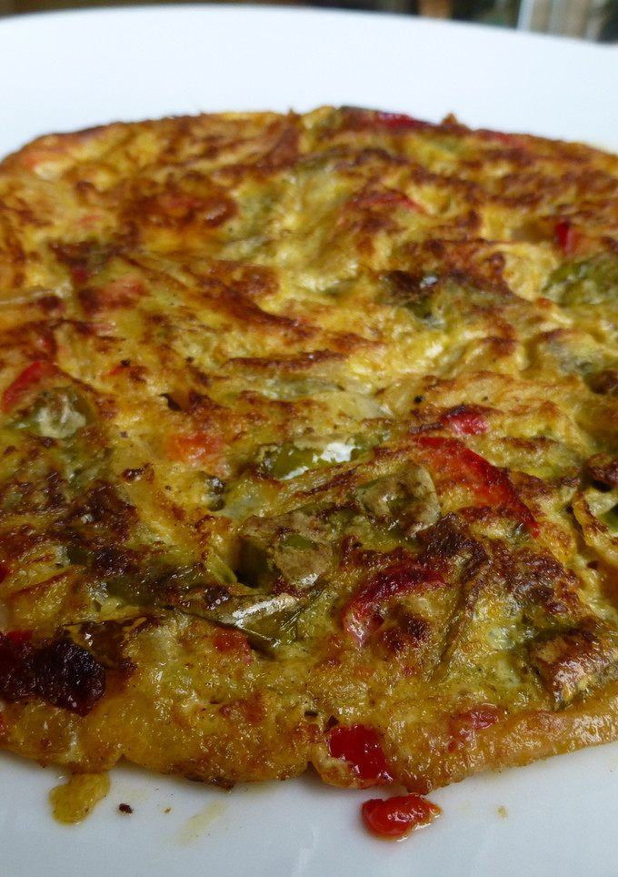 Una foto de Tortilla de pimientos y cebolla