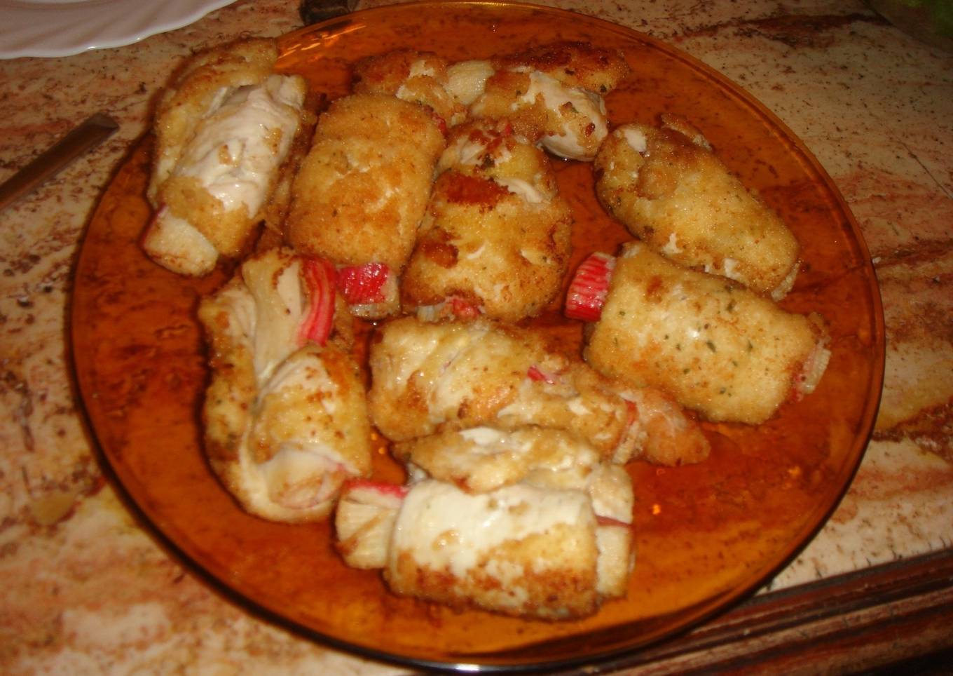 Rollitos de pechuga de pollo rellena de surimi de cangrejo