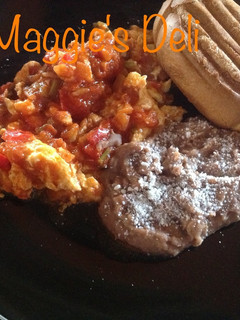 Una foto de Huevos en salsa