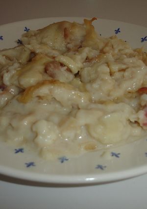 Una foto de Coliflor al horno, serrano y bechamel