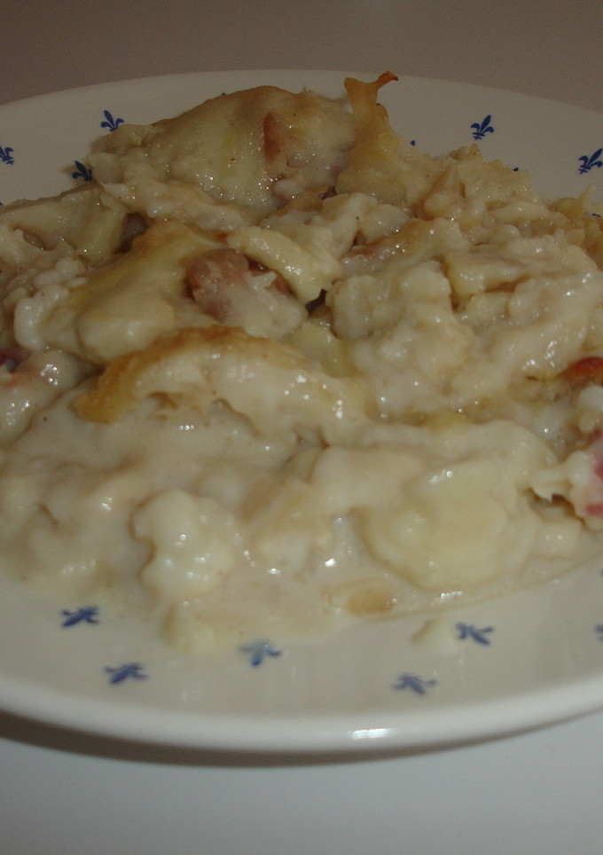 Una foto de Coliflor al horno, serrano y bechamel