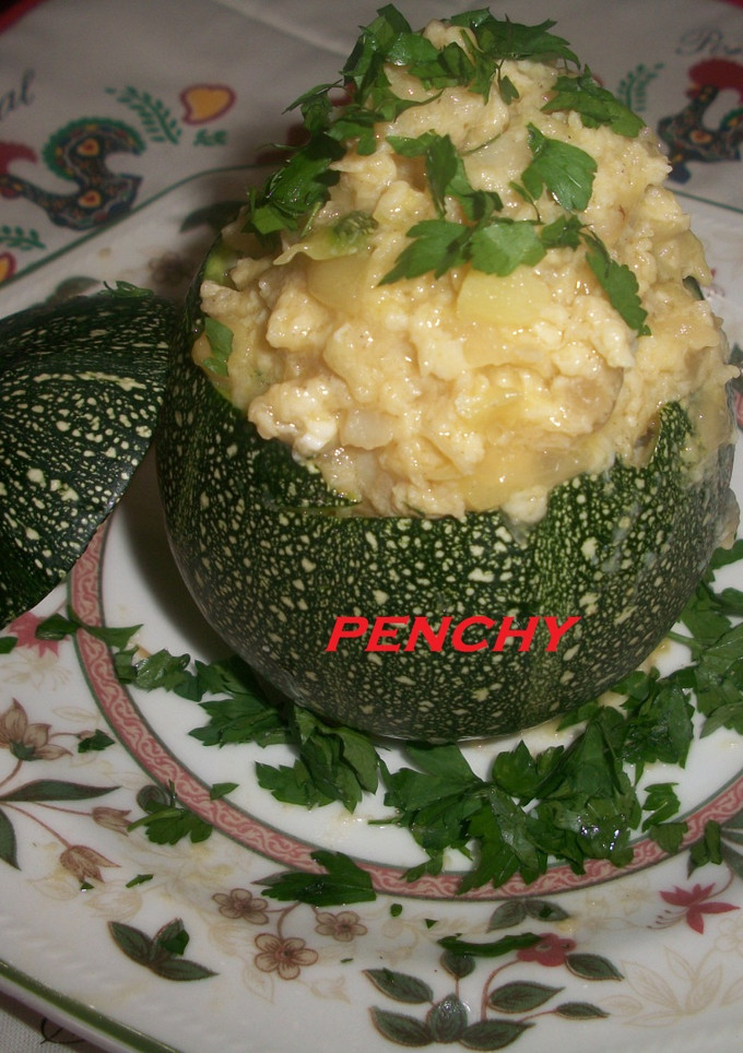 Una foto de Calabacita rellena de bacalao al ajillo