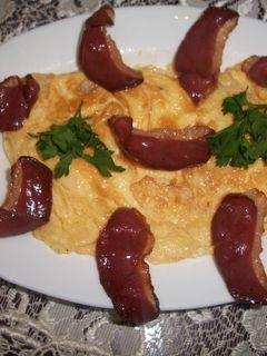 Una foto de Tortilla con grasa de oca y jamón de pato
