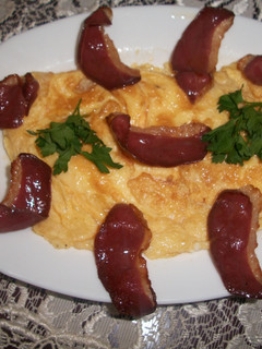 Una foto de Tortilla con grasa de oca y jamón de pato
