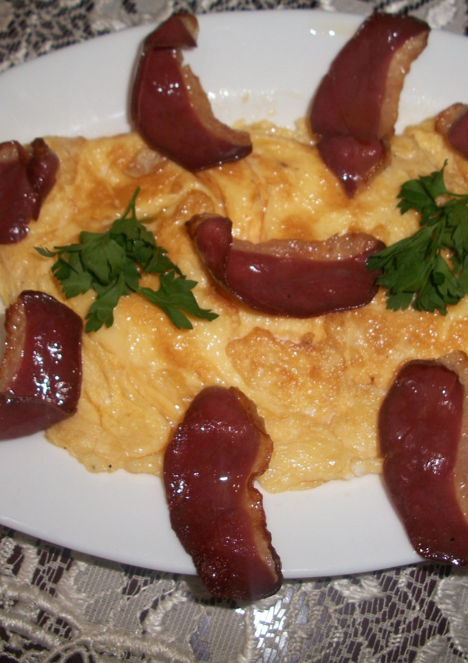 Una foto de Tortilla con grasa de oca y jamón de pato