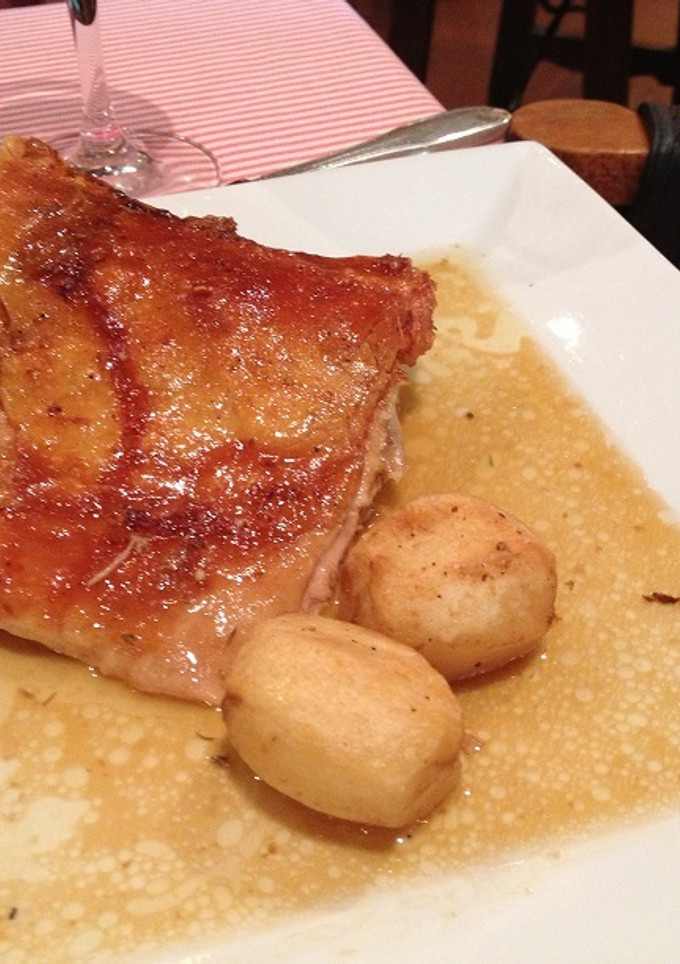 Una foto de Cochinillo caramelizado al horno