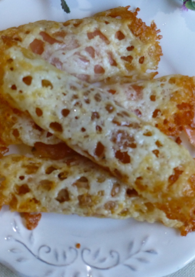 Una foto de Canapés rollo de queso con manzana y canela