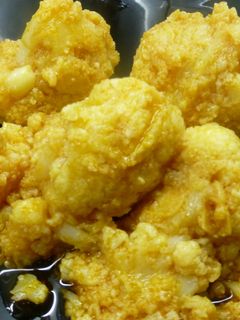 Una foto de Coliflor con ajitos y pimentón