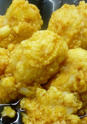 Una foto de Coliflor con ajitos y pimentón