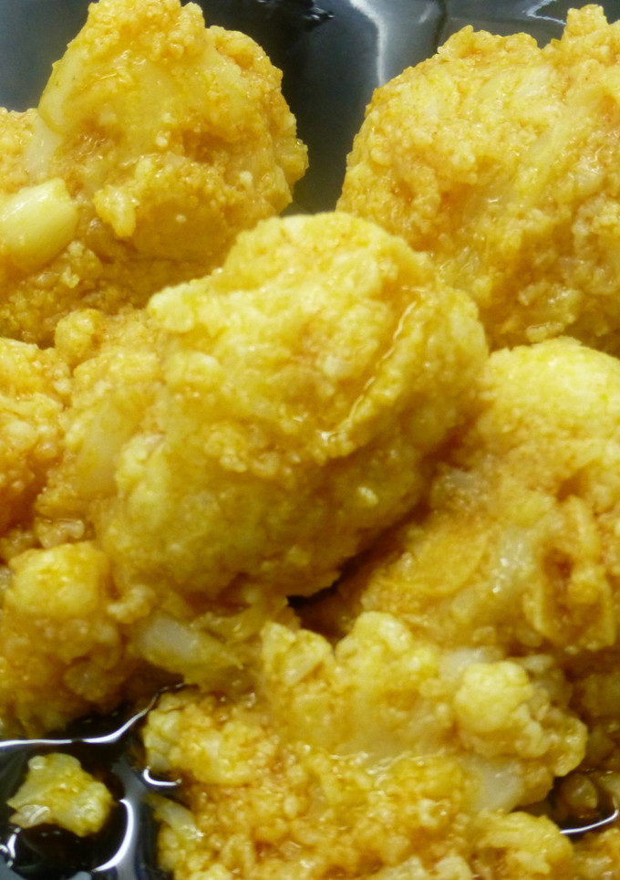 Una foto de Coliflor con ajitos y pimentón