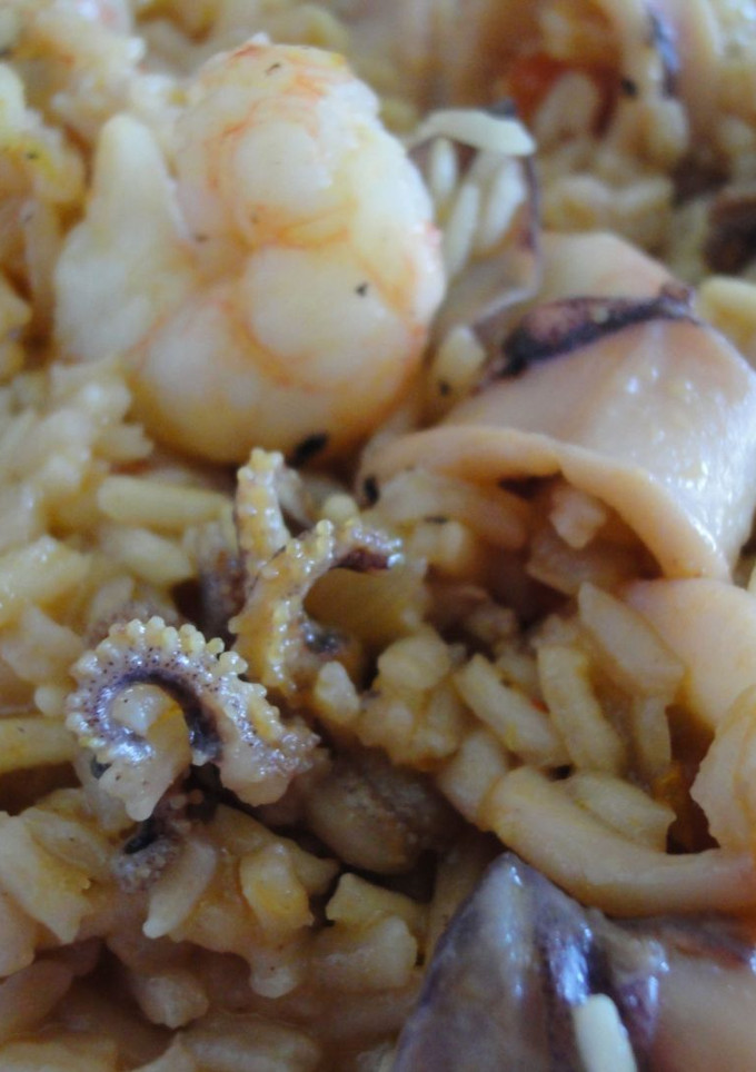 Una foto de Arroz con chipirones y gambas