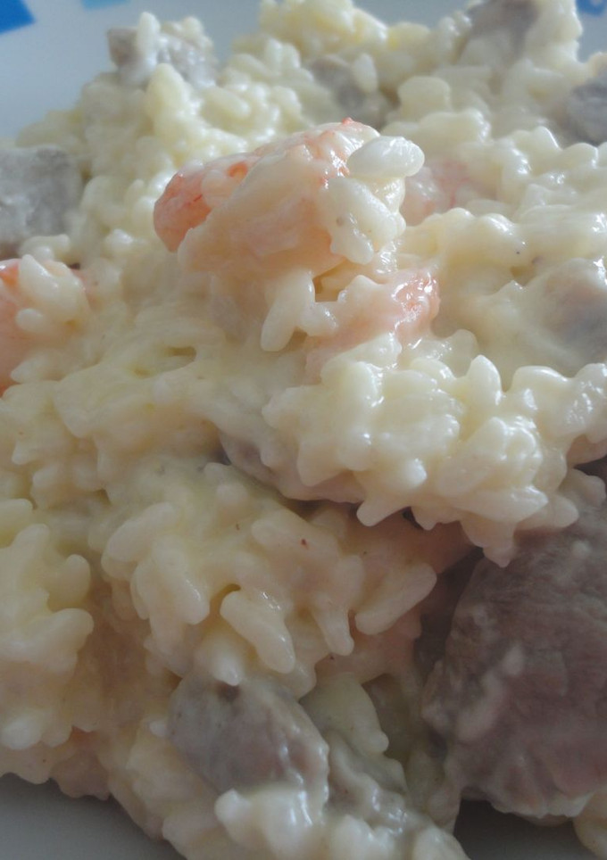 Una foto de Risotto de gambas y solomillo