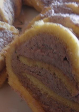 Una foto de Arrolladitos de crema con manteca al chocolate