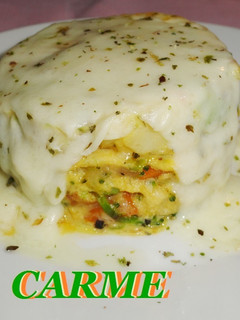 Una foto de Timbal de tortilla de verduras gratinada