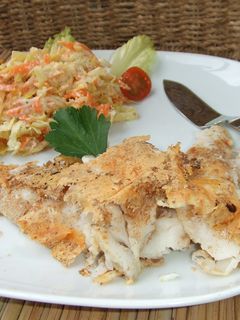 Una foto de Merluza con costra de queso parmesano