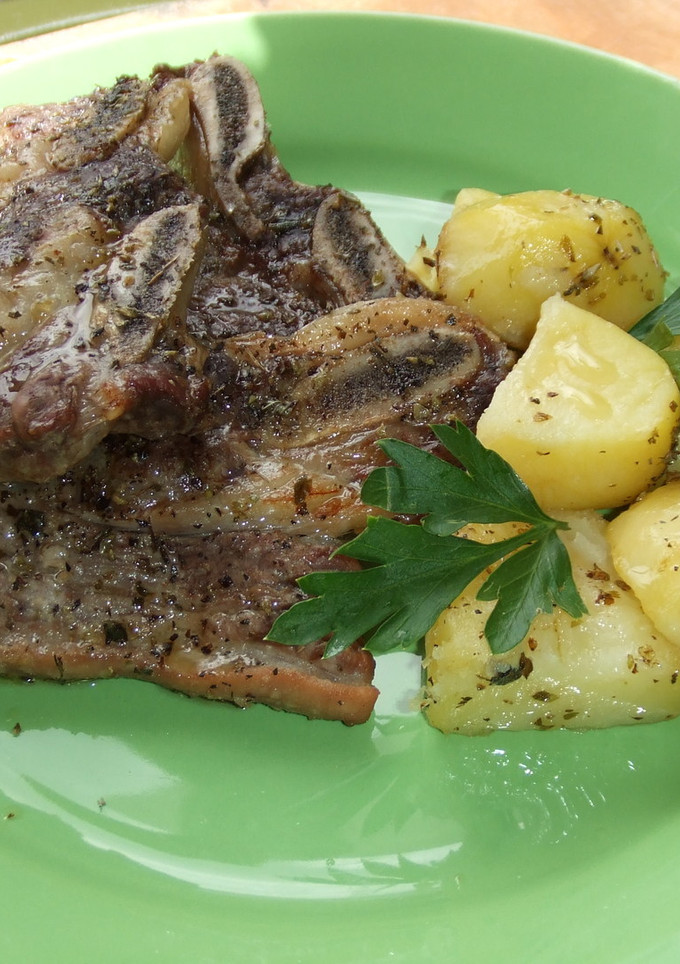 Una foto de Asado al horno con papas