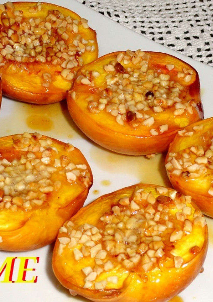 Una foto de Melocotones al horno con almendras y miel