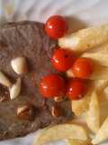 Filetón de ternera con ajos y tomates cherry
