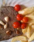 Filetón de ternera con ajos y tomates cherry