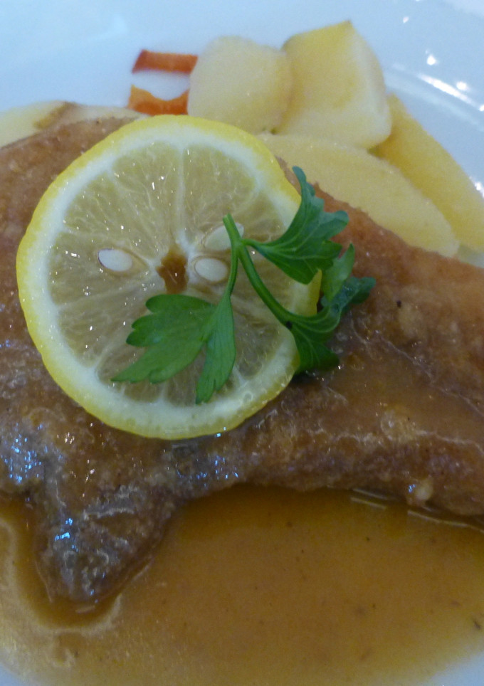 Una foto de Chuleta de cerdo con patatas