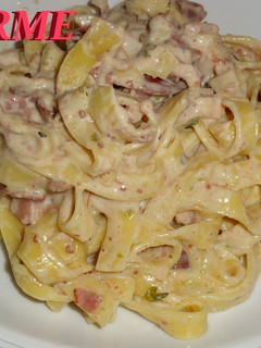 Una foto de Tagliatelle a la crema con beicon y jamón ibérico
