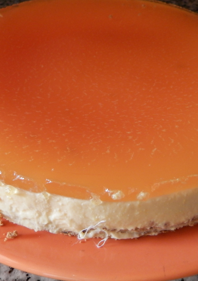 Una foto de Tarta de queso y naranja
