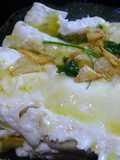 Cogote de merluza al horno con vino blanco