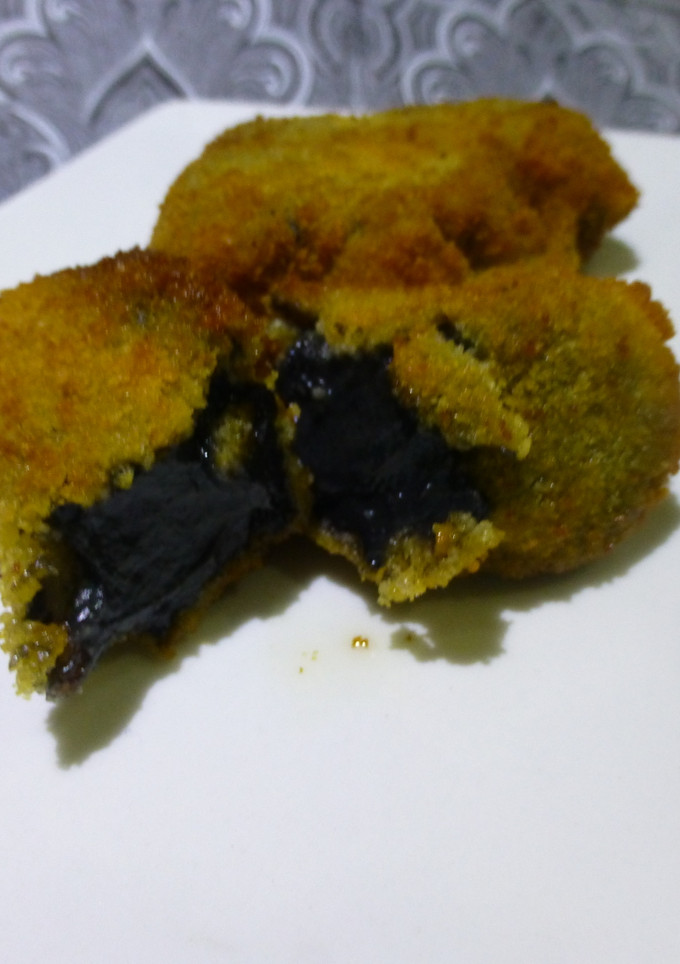 Una foto de Croquetas de chipirones en su tinta