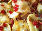 Patatas panadera con pimientos y cebolla