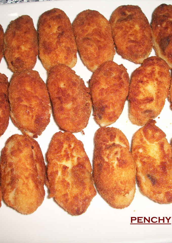 Una foto de Croquetas de gambas y setas al ajillo