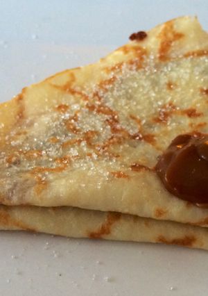 Una foto de Crepes suzette con dulce de leche