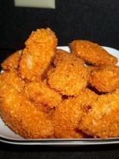 Una foto de Pollo apanado con doritos