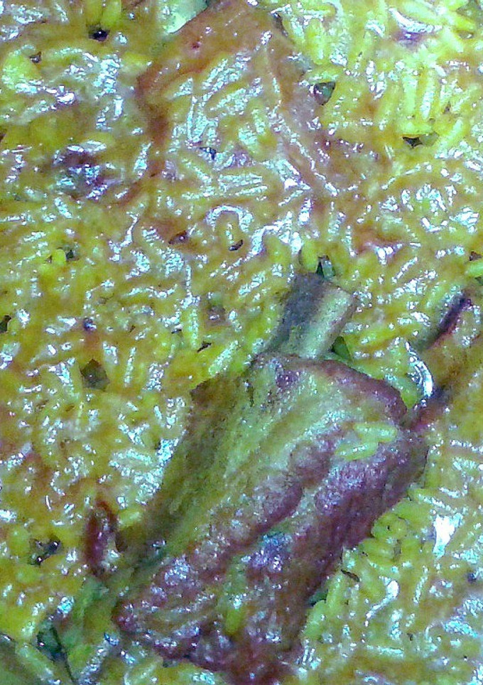 Una foto de Arroz con costillas en caldo de cocido madrileño