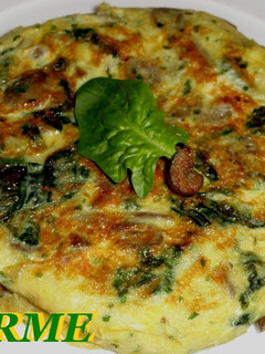 Una foto de Tortilla de espinacas y champiñones