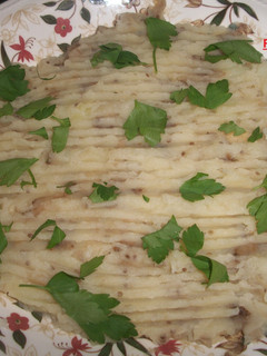 Una foto de Puré de patatas con berenjena al ajo